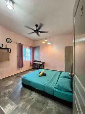 a bedroom with a bed and a ceiling fan at Cameron Mossy Home @ Quintet in Tanah Rata