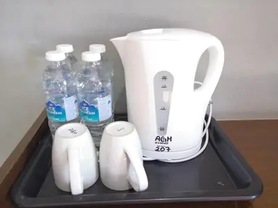 a black tray with bottles of water and a blender at Anggerik Garden Hotel - AG Hotel in Sitiawan