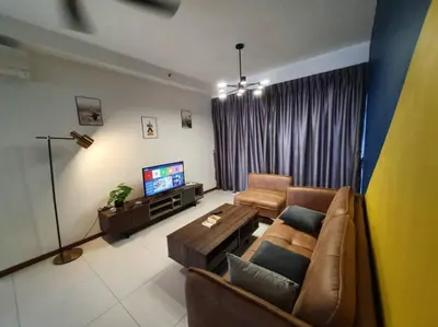 a living room with a couch and a television at The Landmark by Katana 4BR Luxury Seaview Homestay Gurney\u65e0\u654c\u6d77\u666f\u56db\u623f\u5957\u623f in Tanjong Tokong