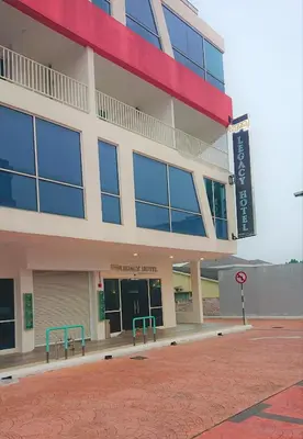 a large building with a sign in front of it at Legacy Hotel Ipoh in Ipoh