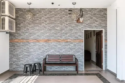a hallway with a bench and a brick wall at 3133 Heritage Home in George Town