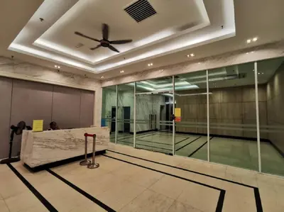 an empty tennis court with a ceiling fan at Mansion One, Private Room in George Town