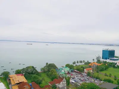 an aerial view of a city and the water at Mansion One, Private Room in George Town