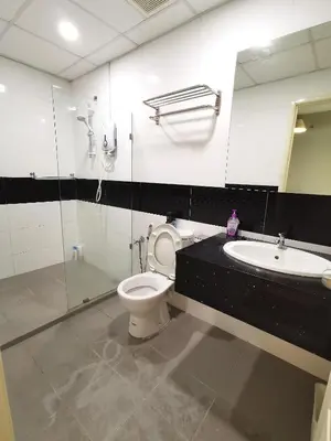 a bathroom with a toilet and a sink at Mansion One, Private Room in George Town