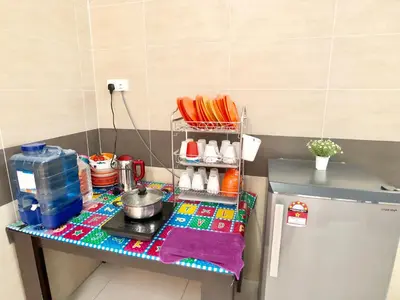 a table in a kitchen with a counter top at Kampar Sakura 3 Landed in Kampar