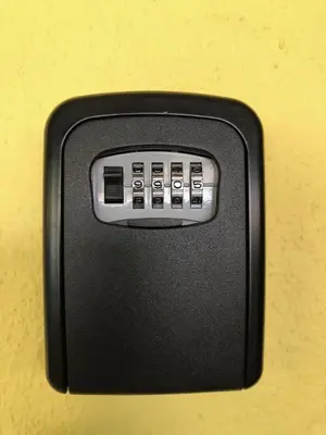 a black electronic device on a yellow wall at Kampar Sakura 3 Landed in Kampar