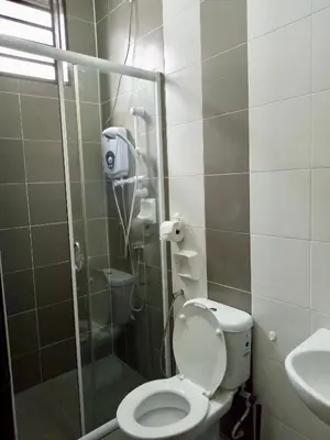 a bathroom with a shower with a toilet and a sink at Kampar Sakura 3 Landed in Kampar