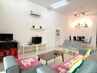a living room with a couch and chairs and a tv at Kampar Sakura 3 Landed in Kampar