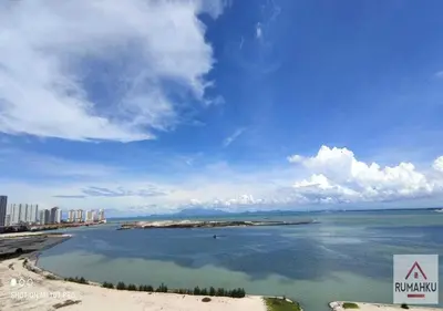 a view of a beach with buildings and the ocean at Rumahku Gurney with 270 degree Sea View in George Town