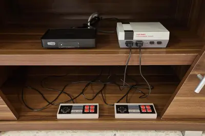 a router and a printer on a shelf at Ipoh Garden Homestay in Ipoh