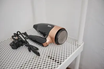 a hair dryer on top of a table at Ipoh Garden Homestay in Ipoh