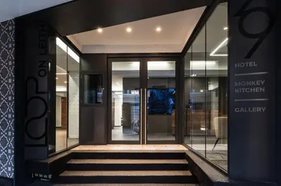 a lobby of a hotel with glass doors at Loop On Leith George Town Penang Hotel in George Town