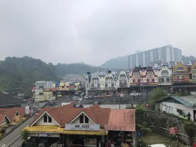 a town with houses and a street with buildings at Super Budget 3 Rooms Apartment @ Brinchang Town in Brinchang
