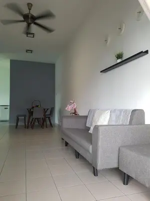 a living room with couches and a ceiling fan at PINKY VILLA in Ipoh