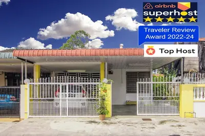 a house with a white gate in front of it at Sweet Home With 2 Auto Gates at BM, Penang, M'sia in Bukit Mertajam