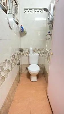 a bathroom with a white toilet in a room at Sweet Home With 2 Auto Gates at BM, Penang, M'sia in Bukit Mertajam