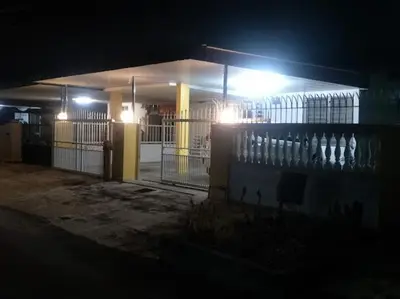 a building lit up at night with lights on it at Sweet Home With 2 Auto Gates at BM, Penang, M'sia in Bukit Mertajam