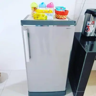 a refrigerator in a kitchen with a counter at Nur Zahra Sungkai Homestay in Sungkai
