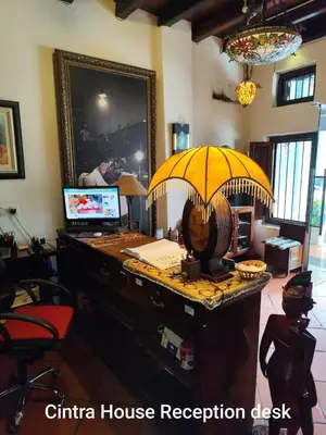 an office with a desk with an umbrella on it at Cintra House in George Town