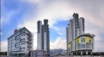 two tall buildings sitting next to each other at Lovely Home Casa Kayangan A2207 in Ipoh