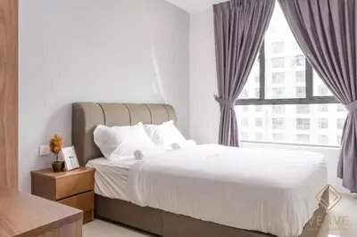 a bedroom with a large bed with a window at Lovely Home Casa Kayangan A2207 in Ipoh