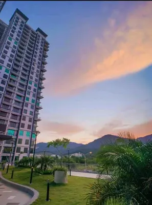 a large apartment building with a view of the mountains at Lovely Home Casa Kayangan A2207 in Ipoh