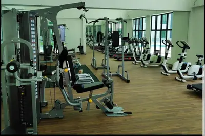 a gym with lots of treadmills and machines at Lovely Home Casa Kayangan A2207 in Ipoh