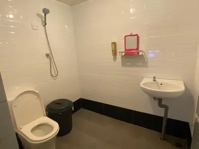 a bathroom with a toilet and a sink at Rustic Chalet - Dahlia n Mawar at Sedim Vista in Kampong Ulu Sedim