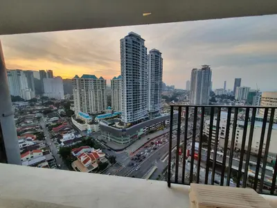 a view of a city with tall buildings and traffic at Seaview Landmark Studio Homestay at Gurney \u65e0\u654c\u6d77\u666f\u5957\u623f in Tanjong Tokong