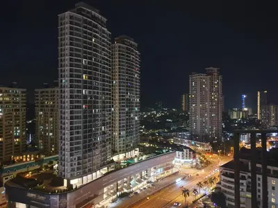 a city skyline with tall buildings at night at Seaview Landmark Studio Homestay at Gurney \u65e0\u654c\u6d77\u666f\u5957\u623f in Tanjong Tokong