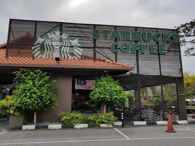 a starbucks coffee building with a sign on it at Seaview Landmark Studio Homestay at Gurney \u65e0\u654c\u6d77\u666f\u5957\u623f in Tanjong Tokong
