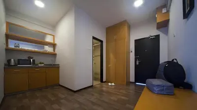 a room with a room with a kitchen and a door at Aranda Nova Suite in Cameron Highlands