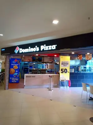 a dominos pizza store with a sign in a mall at Aranda Nova Suite in Cameron Highlands