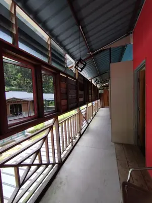 an empty train station with a hallway with windows at MyDusun Chalet, Taiping, Perak, Malaysia in Taiping