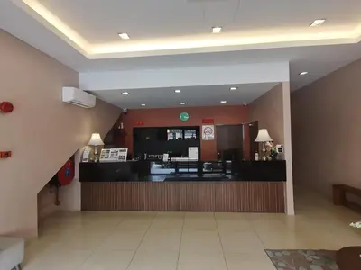 a lobby of a fast food restaurant with a counter at Lumut Hotel in Lumut