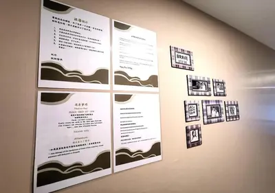a menu on a wall with pictures on it at EM HOMESTAY(Coral Bay 3Room Apartment) in Pangkor