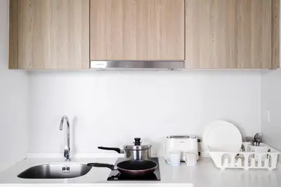 a kitchen counter top with a sink and a stove at Muji Studio 1 - Seaview at 218 Tropicana Near Komtar Food Heaven with Netflix & TV Box in George Town
