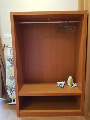 a closet with a wooden shelf in a room at DURIAN HILL VILLA in Gua Musang