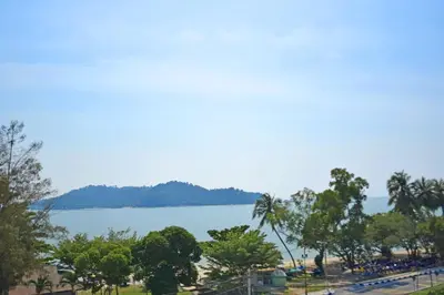 a view of a body of water with trees at AVI Pangkor Beach Resort in Pangkor