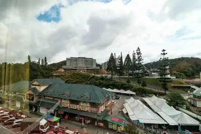 an overhead view of a town with a building at Hotel Rose Crest Hill, Cameron Highlands in Cameron Highlands