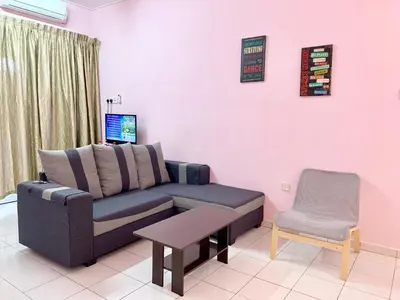 a living room with a couch and a chair at Kampar Sakura 2 Landed in Kampar