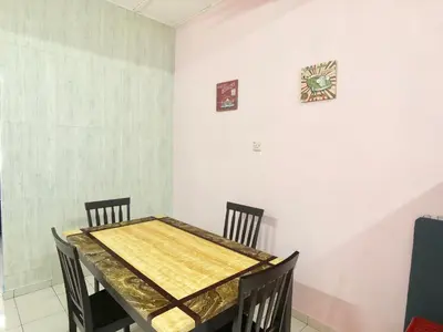 a dining room with a wooden table and chairs at Kampar Sakura 2 Landed in Kampar