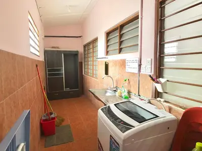 a kitchen with a washing machine and a sink at Kampar Sakura 2 Landed in Kampar