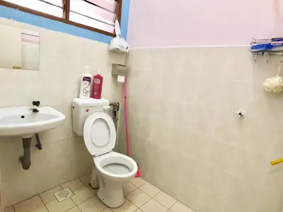 a bathroom with a toilet and a sink at Kampar Sakura 2 Landed in Kampar