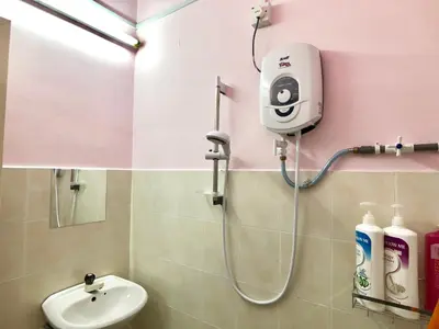 a bathroom with a shower with a toilet and a sink at Kampar Sakura 2 Landed in Kampar