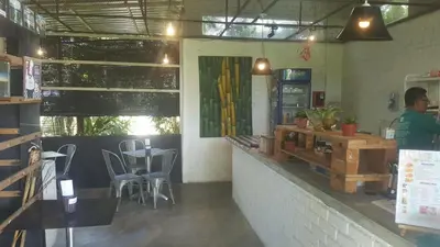 a man standing at the counter of a restaurant at Bellevue The Penang Hill Hotel, Bukit Bendera in Ayer Itam