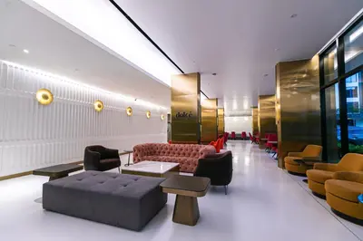 a lobby with a couch and chairs in a building at The Upper House, Batu Kawan in Batu Kawan