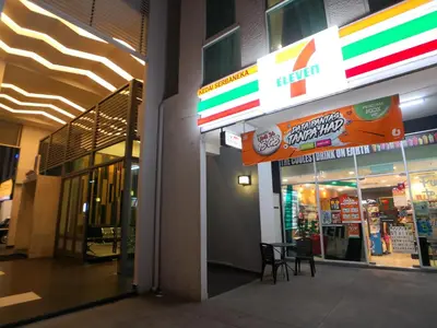 a store front of a store with a sign on it at Maritime Suites by Comfy in George Town