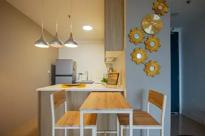 a kitchen with a counter and a table and chairs at Casa Orient @ Macalister 218 ❈中路218东方之家 3BR 8PAX in George Town