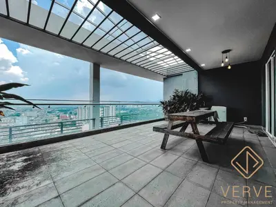 a balcony with a bench and a view of the city at Ipoh Octagon Premium Suites by Verve in Ipoh